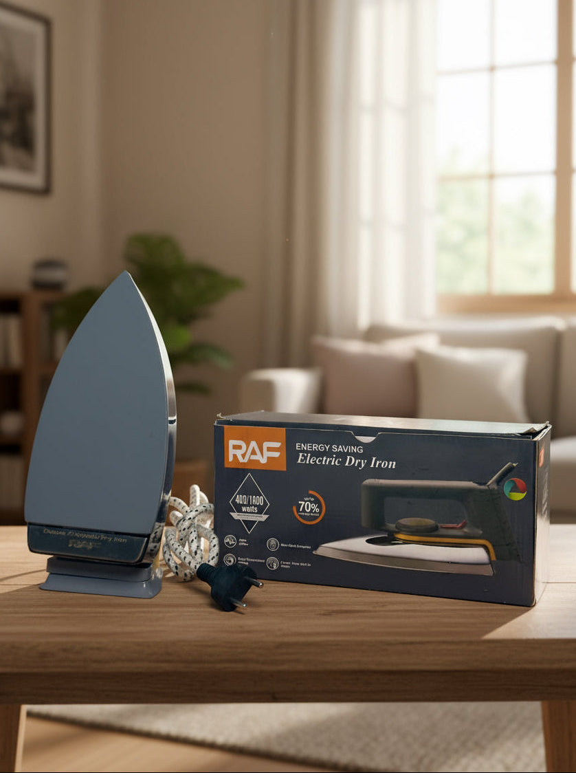 Electric iron and its packaging on a table with a home interior background